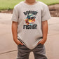 a young boy wearing a white shirt with a fish on it