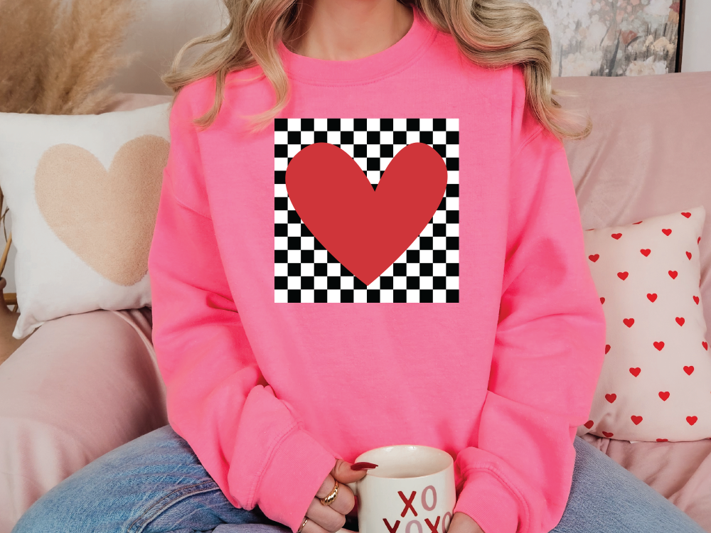 a woman sitting on a couch holding a coffee mug