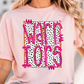 A woman wearing a pink t-shirt with the text "Warriors" printed on it.