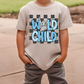 a young boy wearing a t - shirt with the words world child on it