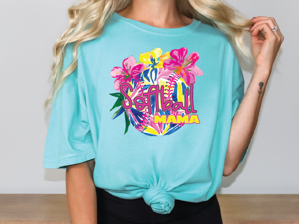 a woman with blonde hair wearing a turquoise shirt