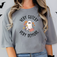 a woman wearing a grey shirt with a ghost on it