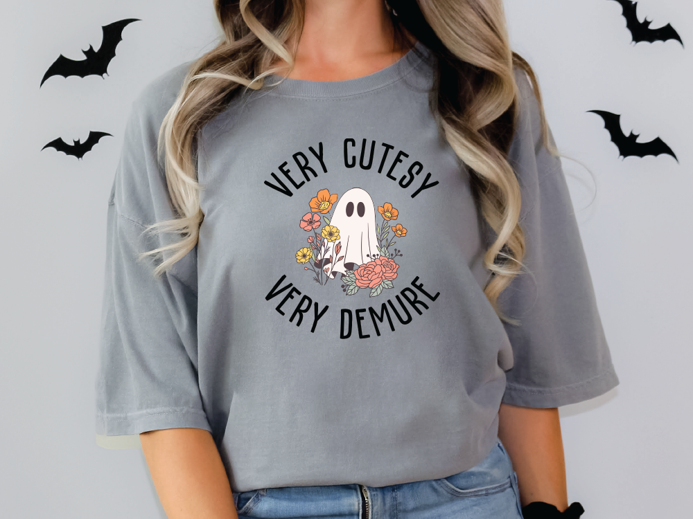 a woman wearing a grey shirt with a ghost on it