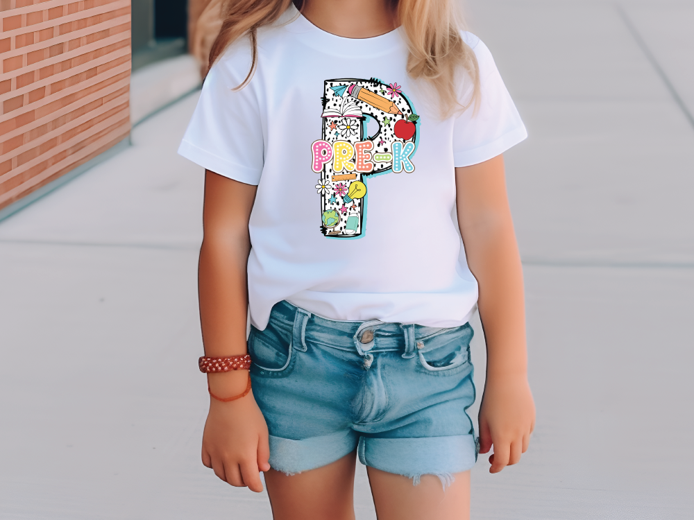 a little girl wearing a white shirt and denim shorts