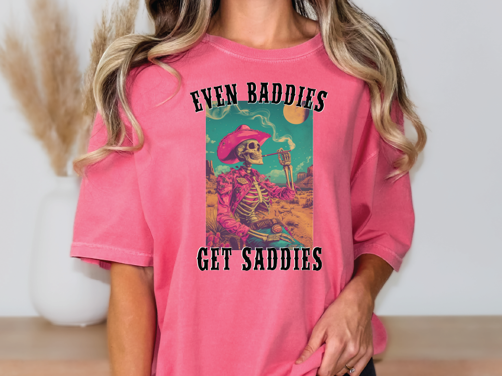 a woman wearing a pink shirt with a skeleton on it