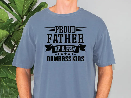 a man wearing a blue t - shirt that says proud father of a few dumb