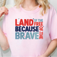 a blonde woman wearing a pink land of the free because of the brave t -