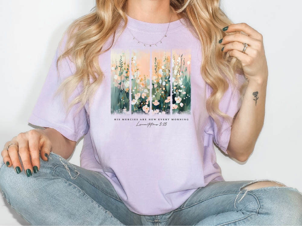 a woman wearing a t - shirt with flowers on it