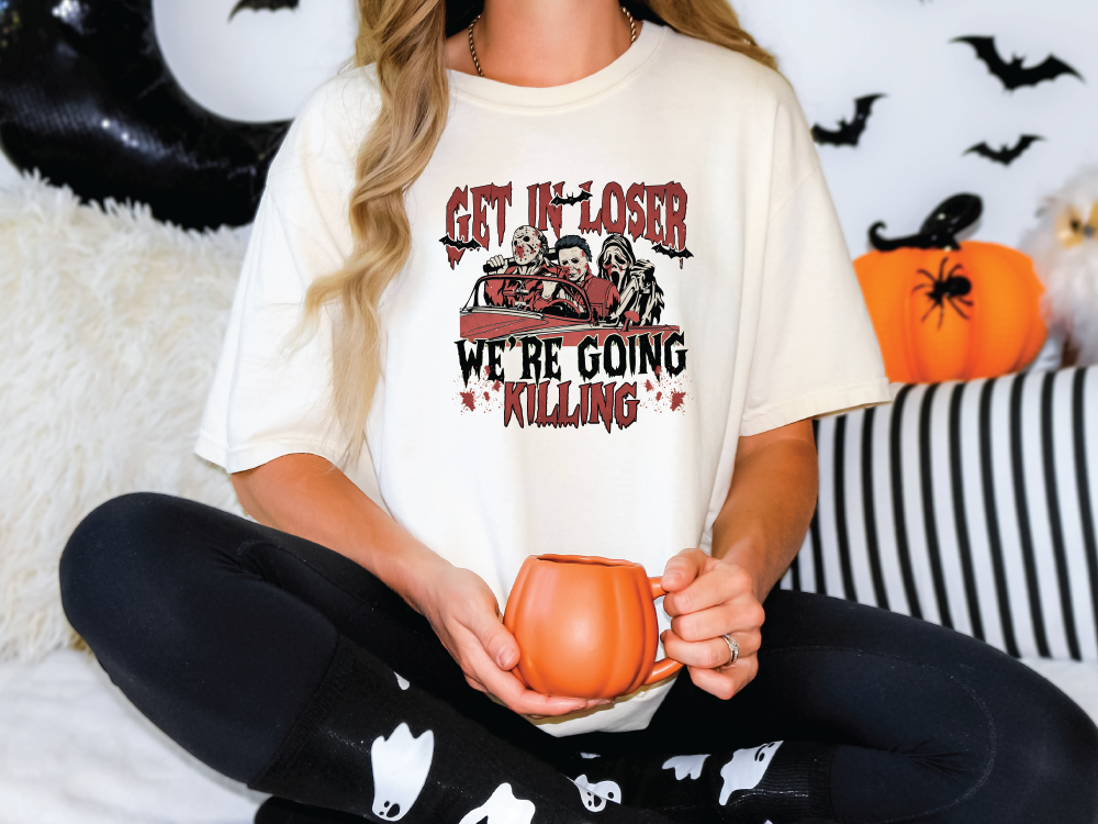 a woman sitting on a bed holding a mug