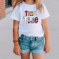 a little girl wearing a tiny time t - shirt