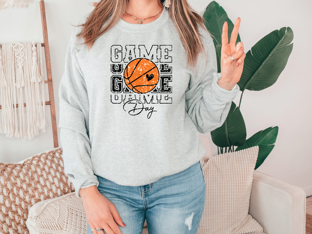 a woman wearing a sweatshirt that says game over with a basketball on it