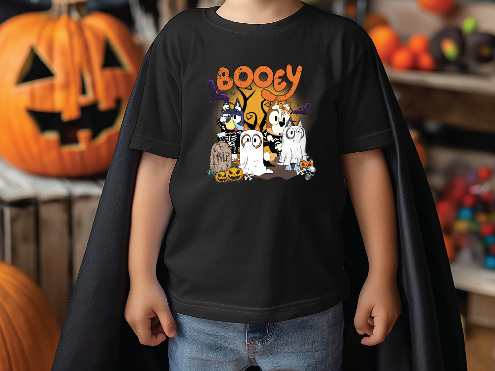 a young boy wearing a booy halloween t - shirt