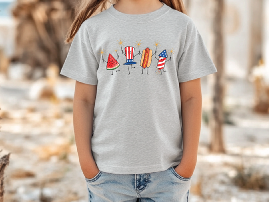 A child wearing a gray t-shirt with a graphic design of four cartoon hot dogs in different poses and colors.