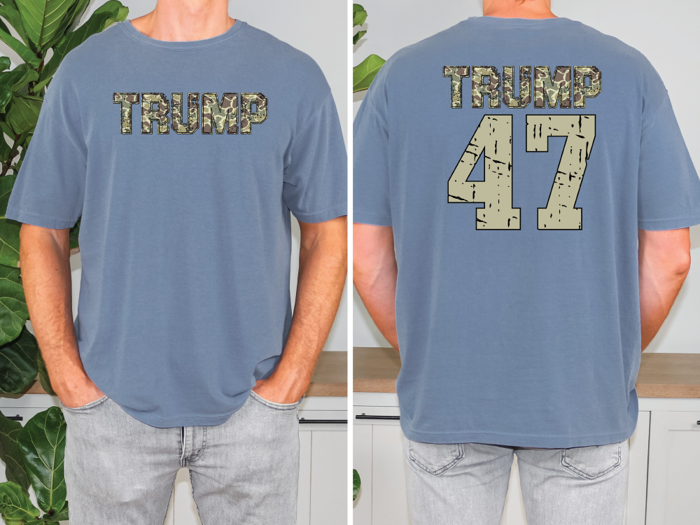 a man wearing a blue shirt with the words trump 47 printed on it