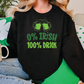 a woman sitting on a couch wearing a st patrick's day sweatshirt