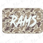 A camouflage-patterned rectangular object with the word "RAMS" written in a stylized, graffiti-like font.