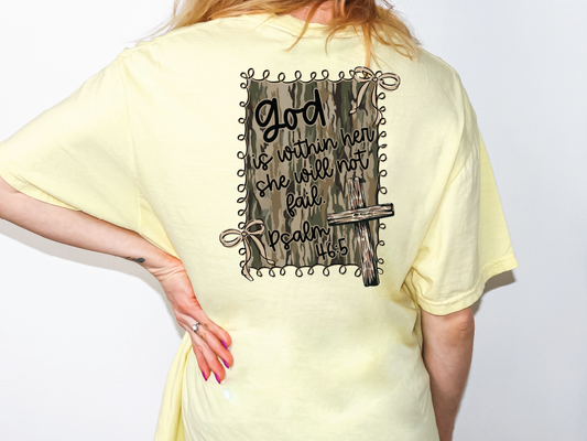 A person wearing a yellow t-shirt with a graphic design on the back, featuring a Bible verse and a wooden door.