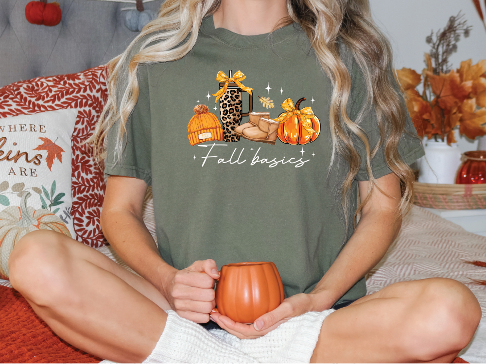 a woman sitting on a bed holding a pumpkin