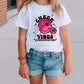 a young girl wearing a cheer vibes t - shirt