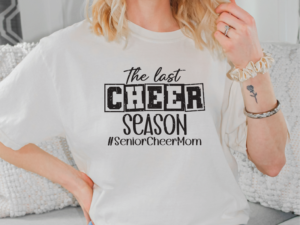 a woman wearing a t - shirt that says the best cheer season