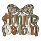 A stylized graphic design featuring the text "Hunting Season" with a camouflage bow on top.