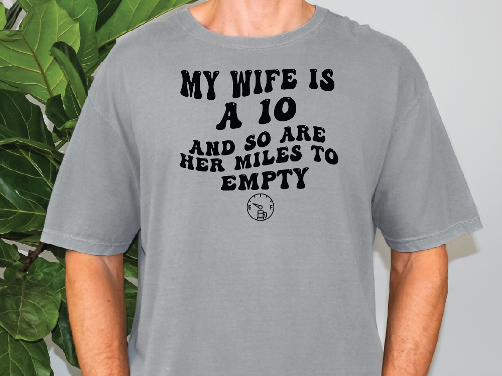 a man wearing a grey t - shirt that says, my wife is a 10