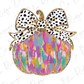 a colorful pumpkin with a polka dot bow