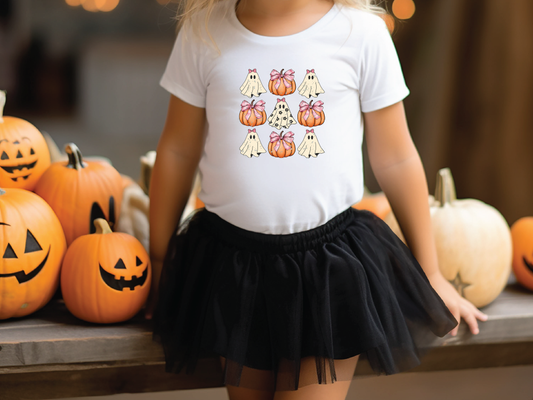 a little girl wearing a white shirt and black skirt