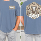 a man wearing a blue t-shirt with a camouflage pattern and a graphic of a ram on the back.