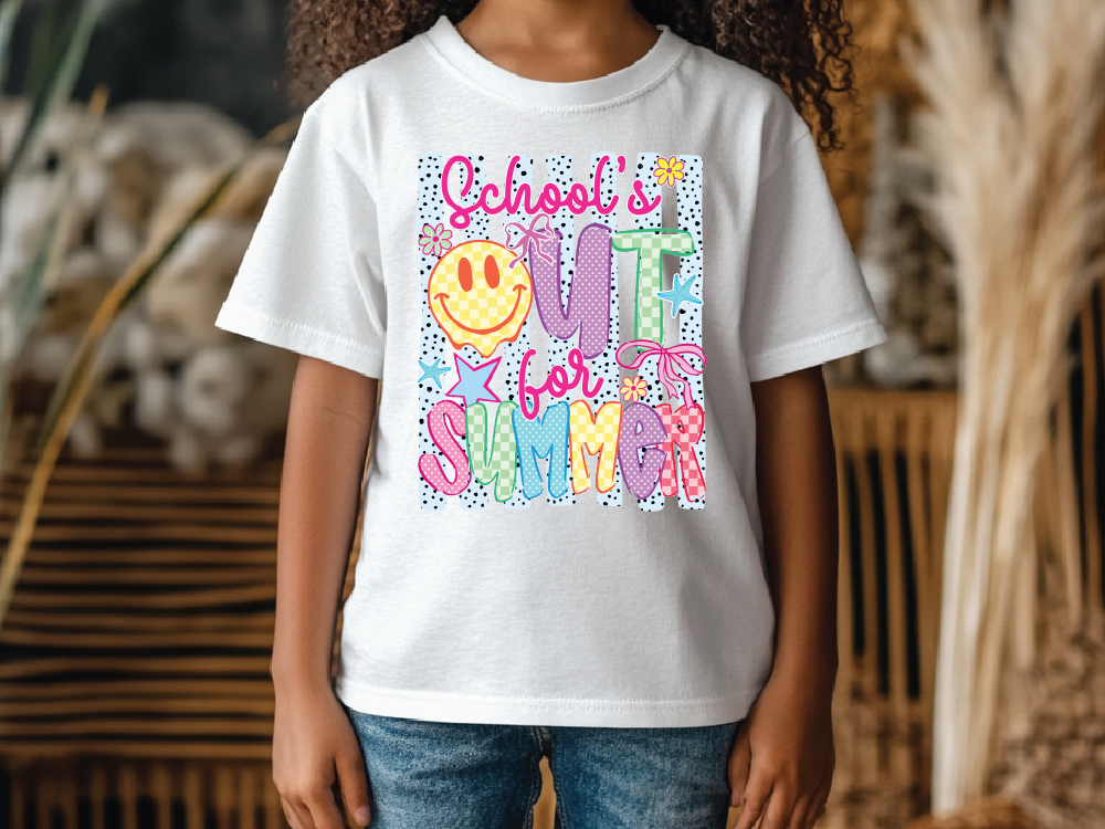 A child wearing a white t-shirt with a colorful graphic design featuring a smiley face and the text "School's out for summer".