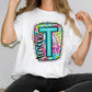 a woman wearing a t shirt with the letter t on it