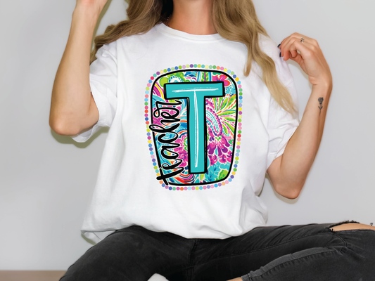 a woman wearing a t shirt with the letter t on it