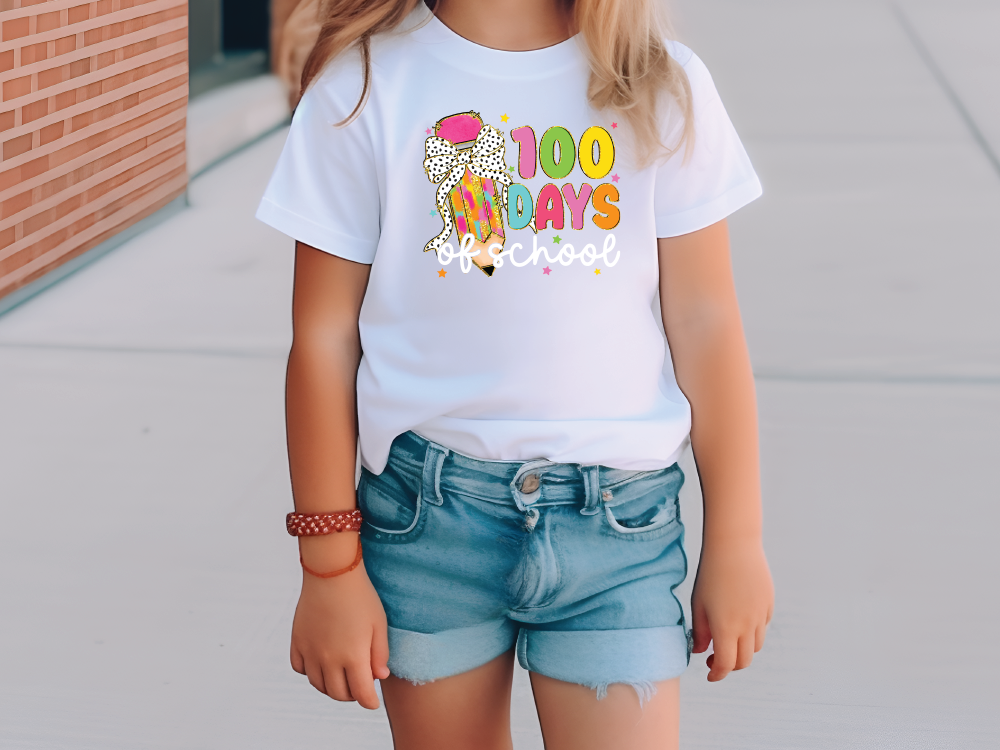 a little girl wearing a white shirt and denim shorts