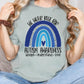 a woman wearing a t - shirt that says autism awareness