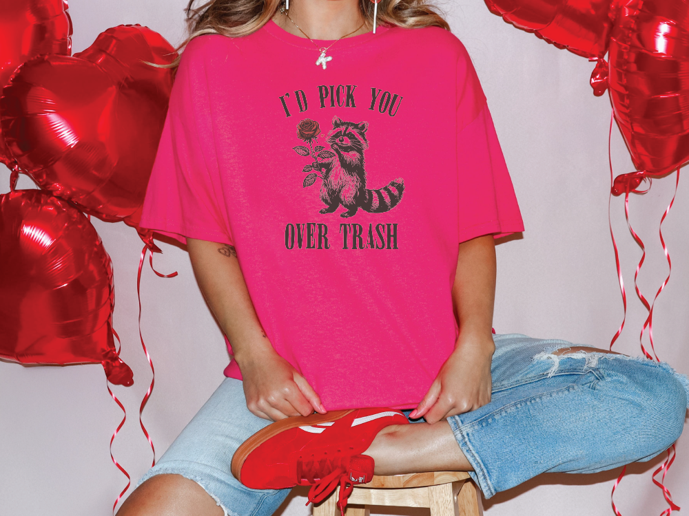 a girl sitting on a stool with red balloons behind her