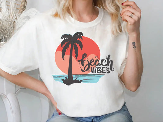 a woman wearing a beach vibes t - shirt