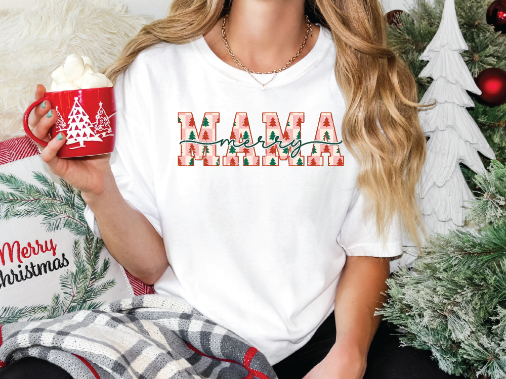 a woman holding a cup of coffee in front of a christmas tree