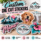 Custom die cut vinyl stickers cut to the exact shape of your design, stacked on a work table