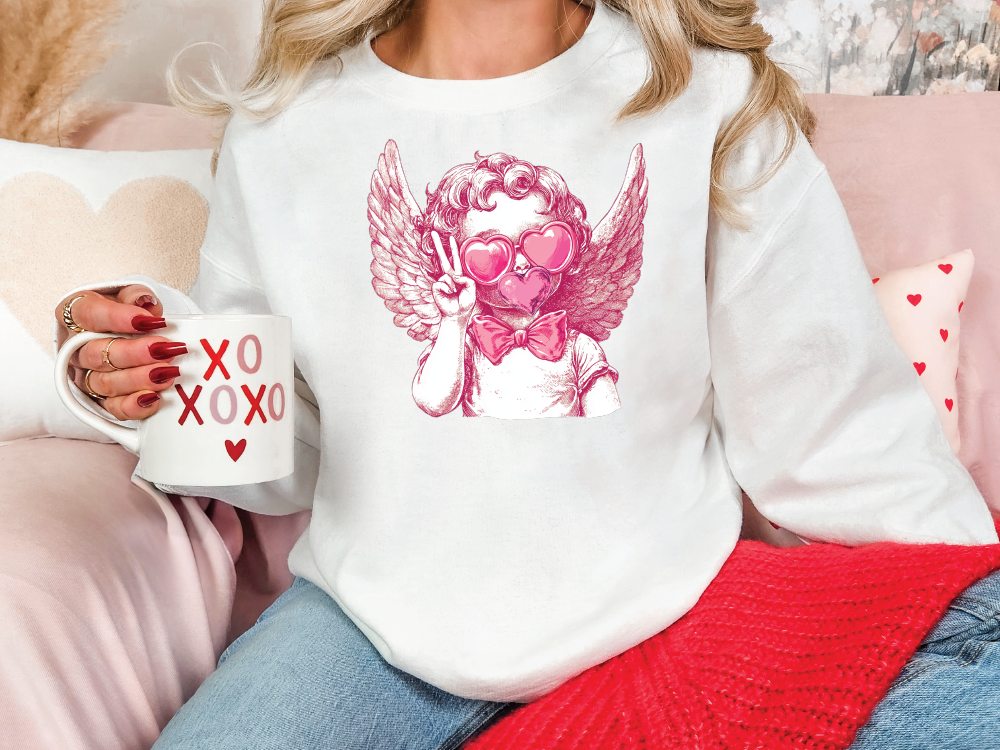 a woman sitting on a couch holding a coffee mug