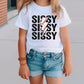 a little girl standing on a sidewalk wearing a baseball shirt