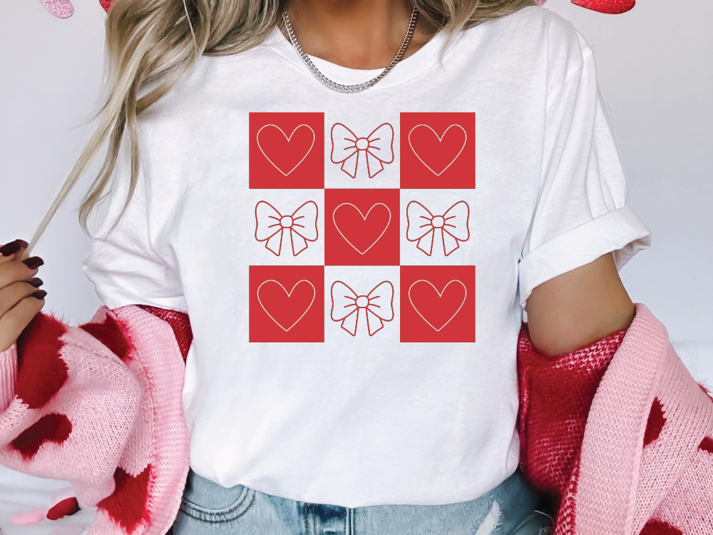 a woman wearing a t - shirt with hearts on it