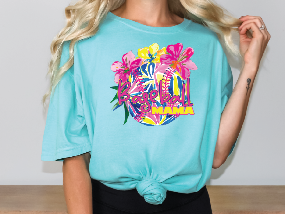 a woman with blonde hair wearing a turquoise shirt