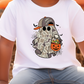 A white t-shirt with a graphic of a ghost character wearing a baseball cap and holding a carved pumpkin, surrounded by Halloween-themed elements.