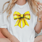 a woman sitting on a couch wearing a softball bow t - shirt