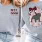 The image is a collage of two photos of a person wearing a grey sweatshirt with a graphic design on the back.