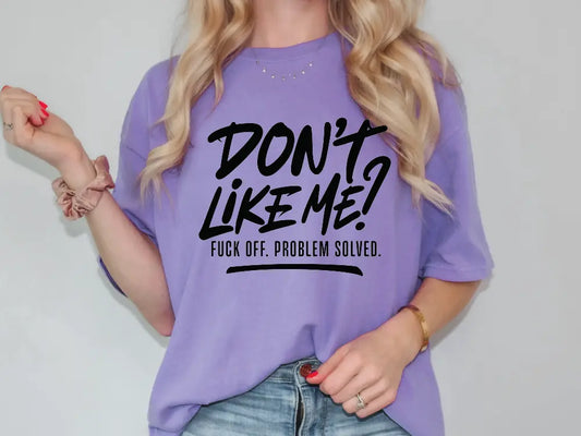 a woman wearing a purple shirt that says don't like me