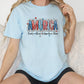 a woman sitting on a couch wearing a t - shirt that says america