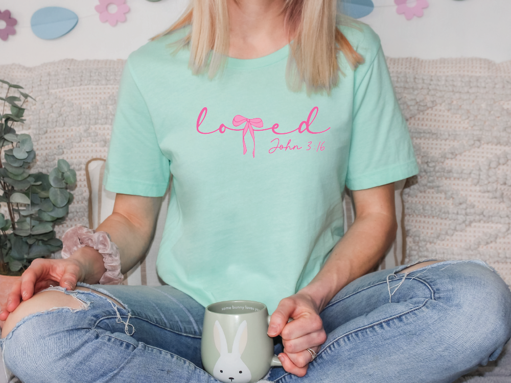 a woman sitting on a couch holding a coffee cup