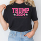 a blonde woman wearing a trump t - shirt