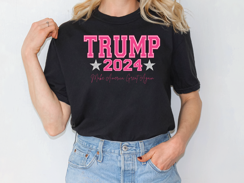 a blonde woman wearing a trump t - shirt